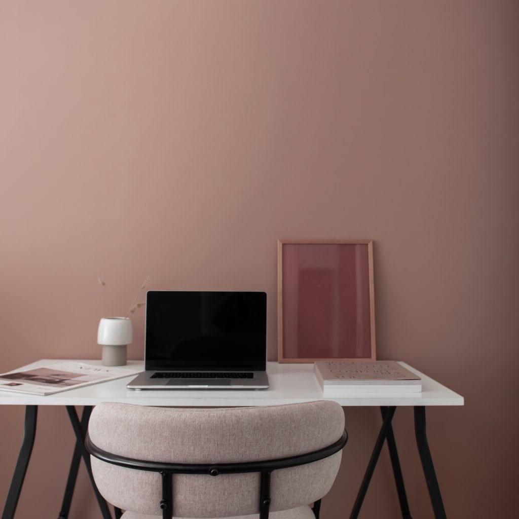 Pink desk scene from blog post "Pinterest Marketing Tips" by Wildflower Pinterest Management